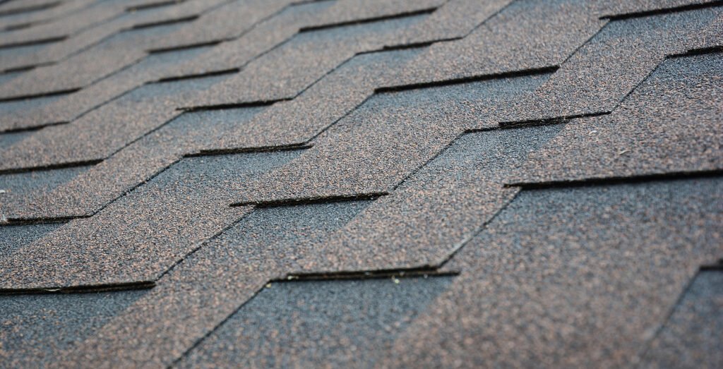 Close Up On House Roof Asphalt Shingles Texture. Roof Asphalt Sh